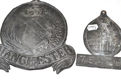 Lot 402 - Two lead fire marks, one stamped Manchester, the other numbered 754398