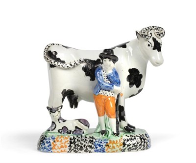 Lot 205 - A Pratt Type Pottery Cow Group, circa 1800, as a farmer standing before a cow, a calf at their...