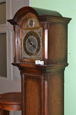 Lot 508 - Grandmother clock in an oak case, with key