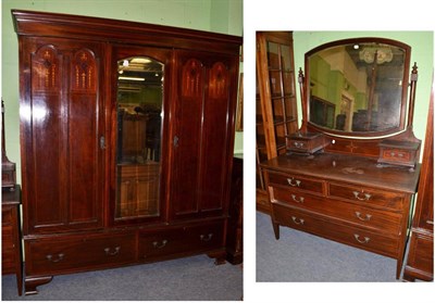 Lot 515 - An Edwardian mahogany triple door wardrobe and matching dressing table