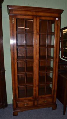 Lot 516 - Titchmarsh & Goodwin oak display cabinet with leaded glass doors