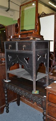 Lot 526 - A late Victorian carved oak writing table, two drawer chest and a Victorian mirror