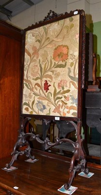 Lot 533 - A Victorian carved hardwood fire screen