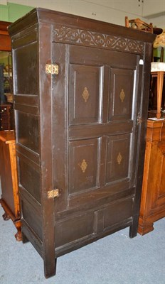 Lot 544 - A carved oak food cupboard