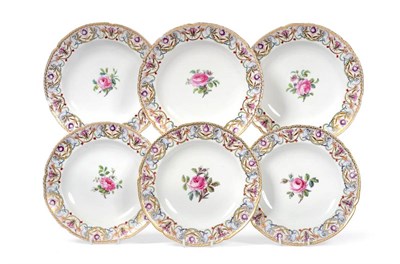 Lot 227 - A Set of Six Berlin Porcelain Plates, late 18th century, painted with rose sprigs within formal...