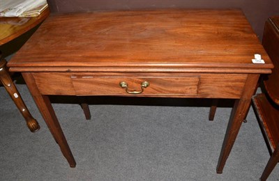 Lot 562 - A George III mahogany fold-over tea table