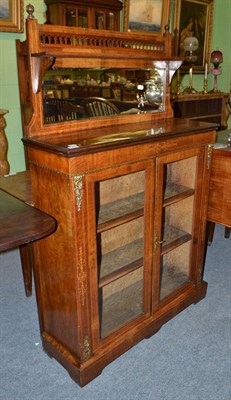 Lot 565 - A Victorian figured walnut pier cabinet with superstructure back