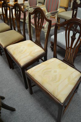 Lot 580 - A set of four George III style dining chairs