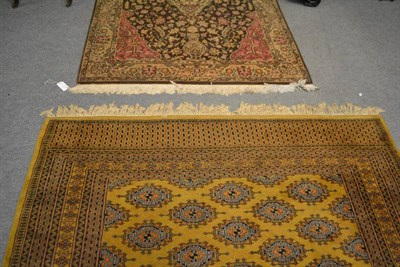 Lot 588 - A 'Bukhara' style rug, Lahore, Punjab, the mustard field with columns of Salor guls enclosed by...