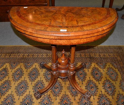 Lot 589 - Victorian walnut and crossbanded semi-circular fold over card table