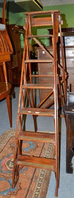 Lot 590 - A pair of reproduction library steps with brass treads