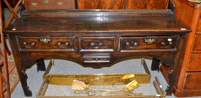 Lot 591 - An early 18th century oak dresser base, lacking rack