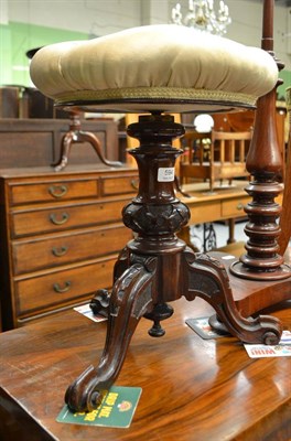 Lot 594 - A Victorian walnut revolving piano stool