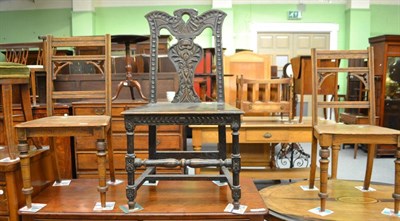 Lot 597 - A Victorian carved oak hall chair and a pair of late Victorian oak hall chairs