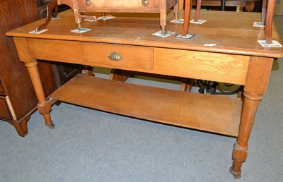 Lot 600 - An oak two tier draper's shop table with single drawer