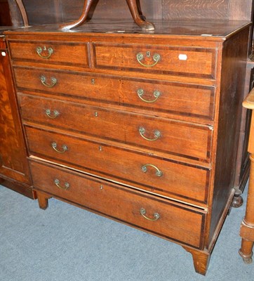 Lot 602 - A late George III oak and mahogany crossbanded six drawer chest