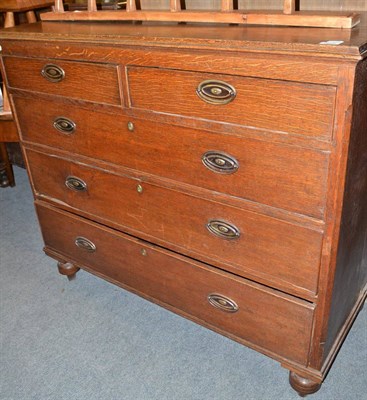 Lot 608 - An oak four height chest of drawers