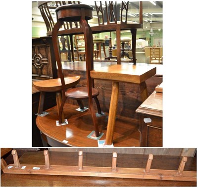 Lot 609 - Two Yorkshire made stools, a pine coat rack and a mahogany plant stand (4)