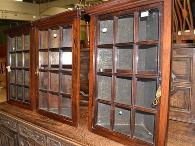 Lot 611 - Three rosewood hanging corner cupboards