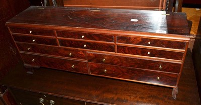 Lot 619 - An unusual mahogany small chest with hinged lid and an arrangement of drawers