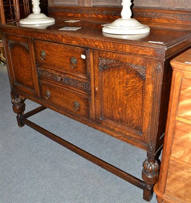 Lot 624 - A 1920s oak sideboard