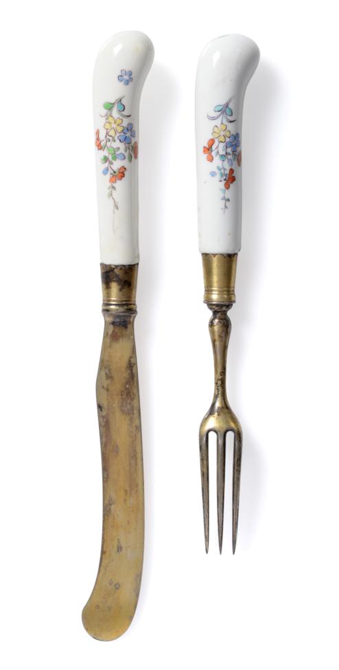 Lot 235 - A French Porcelain-Handled Dessert Knife and Fork, probably Chantilly, circa 1740, the handles...