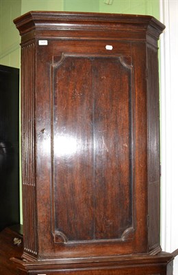 Lot 628 - A 19th century oak corner cabinet