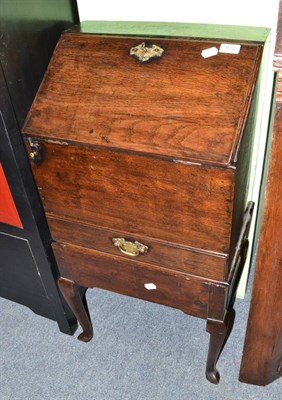 Lot 630 - An 18th century oak bureau of small proportions on stand