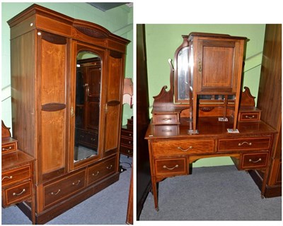 Lot 636 - An Edwardian mahogany and marquetry inlaid wardrobe, matching dressing table and bedside cupboard