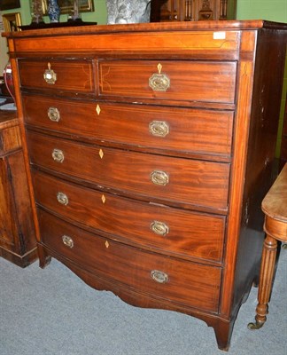 Lot 641 - A late 19th century mahogany and satinwood banded six drawer bow fronted chest