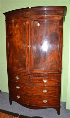 Lot 647 - A Regency style mahogany and ebony strung bow fronted linen press