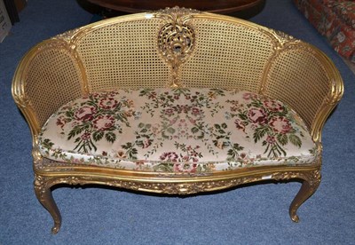 Lot 705 - A French style bergere settee