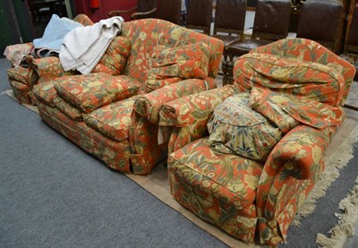 Lot 708 - A three piece suite with loose covers