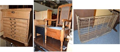 Lot 716 - A pine small cabinet, a fire guard and two commodes