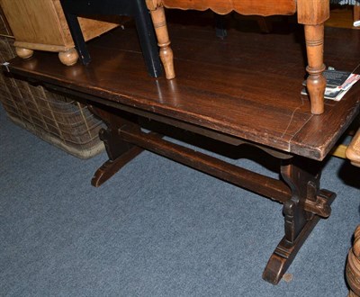 Lot 717 - An oak refectory style dining table