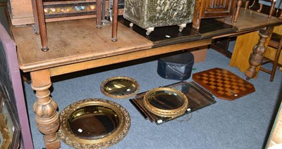 Lot 718 - A late Victorian carved oak extending dining table with additional leaves