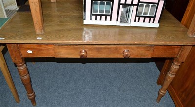 Lot 740 - A pine kitchen table fitted with a single drawer