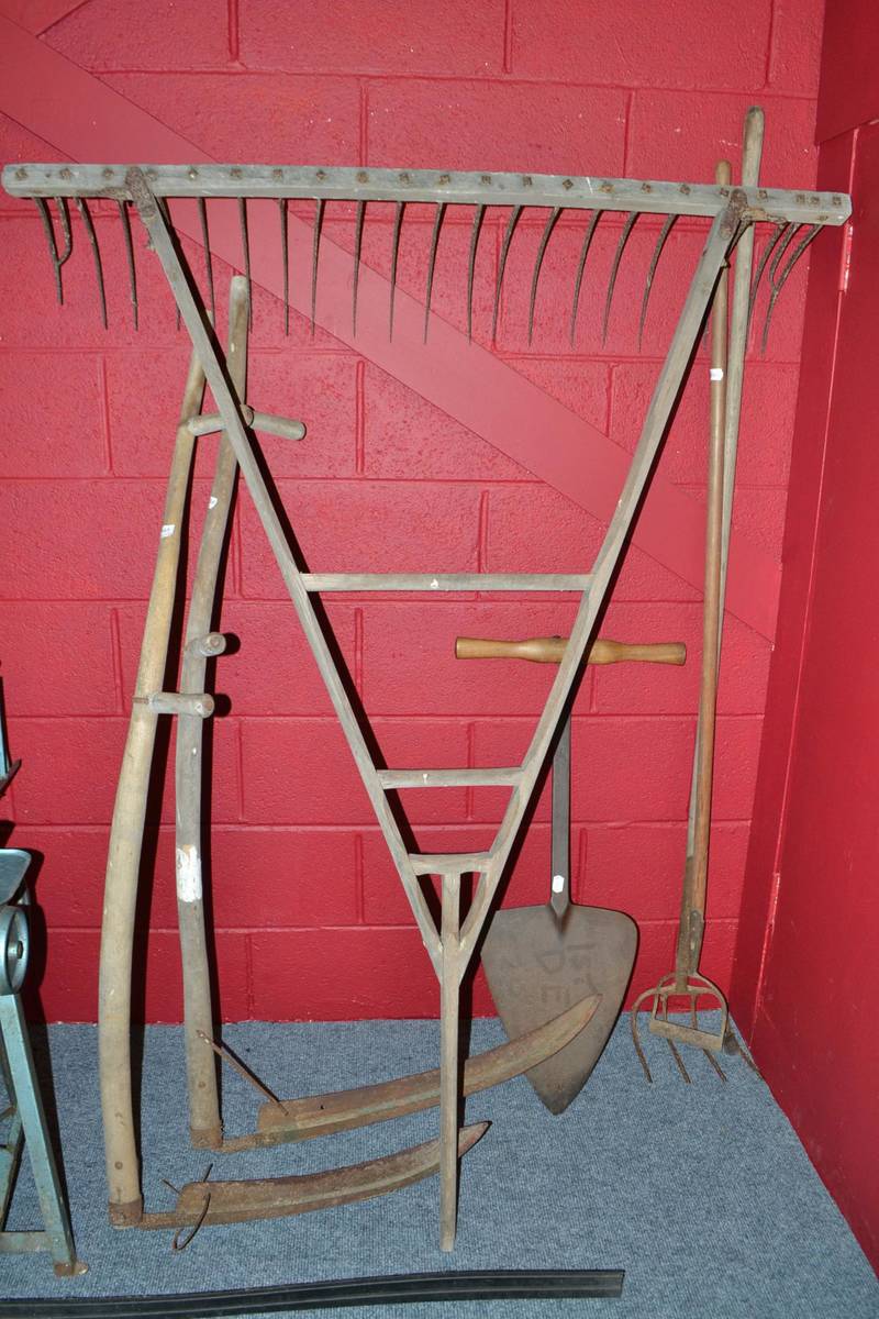 Lot 748 - Hay cutter, muck cowl, hay rake, hoe and two scythes