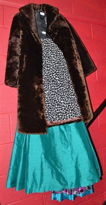 Lot 758 - Four long dresses, a cocktail dress and a fur coat