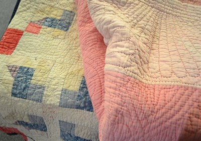 Lot 860 - Pink reversible quilt with pale pink border, 200cm x 235cm and a patchwork quilt with later...