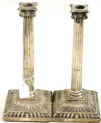 Lot 19 - A pair of George III silver candlesticks, Elizabeth Cooke, London 1765, with fluted square...