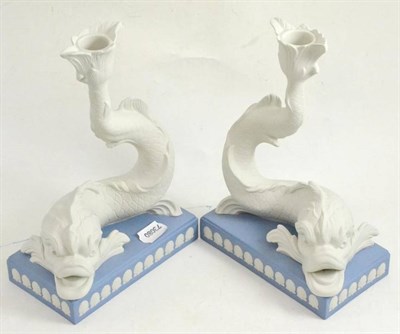 Lot 23 - * A pair of Wedgwood dolphin candlesticks, with box