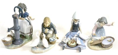 Lot 29 - Four Lladro figures of girls with ducks