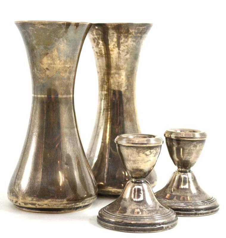 Lot 57 - Pair of silver vases and a pair of squat silver candlesticks (4)