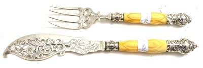 Lot 61 - A set of Victorian silver fish servers with carved ivory handles, Sheffield 1857