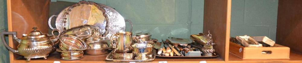 Lot 74 - Two shelves of assorted silver plate including entree dishes, cutlery, trays, etc