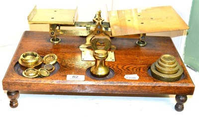 Lot 82 - * A set of brass weighing scales with ivory plaque (lacking some weights)