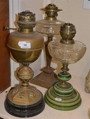 Lot 96 - * Three oil lamps and a box containing oil lamp chimneys, lamps, etc