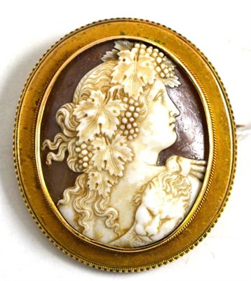 Lot 107 - A cameo brooch carved with a Bacchante, in a late Victorian Etruscan style frame