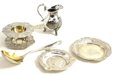 Lot 109 - Small tray, ashtray, tea strainer, silver plated jug and spoon